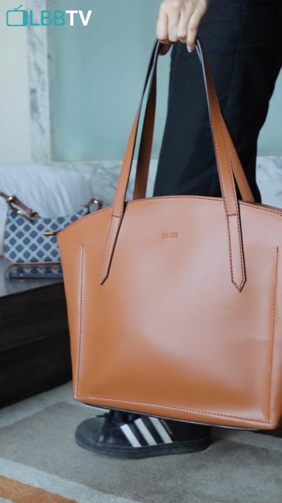 Brown,Product,Luggage and bags,Orange,Sleeve,Bag,Shoulder bag,Grey,Travel,Street fashion